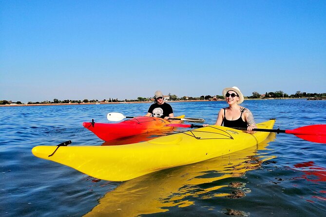 Burano Kayak Eco-Tour Through the Venetian Lagoon - Stop 1: Burano from the water, with the guide in charge