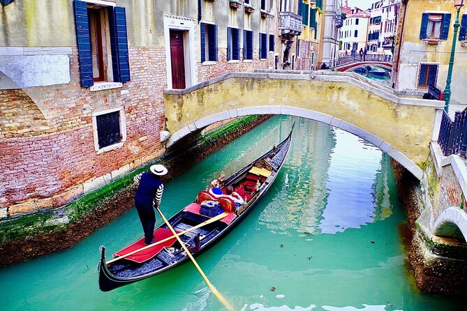 Venice: Enchanting City Walk & Majestic Gondola Glide! - Rialto Bridge and Mercerie streets: classic views plus shopping street context